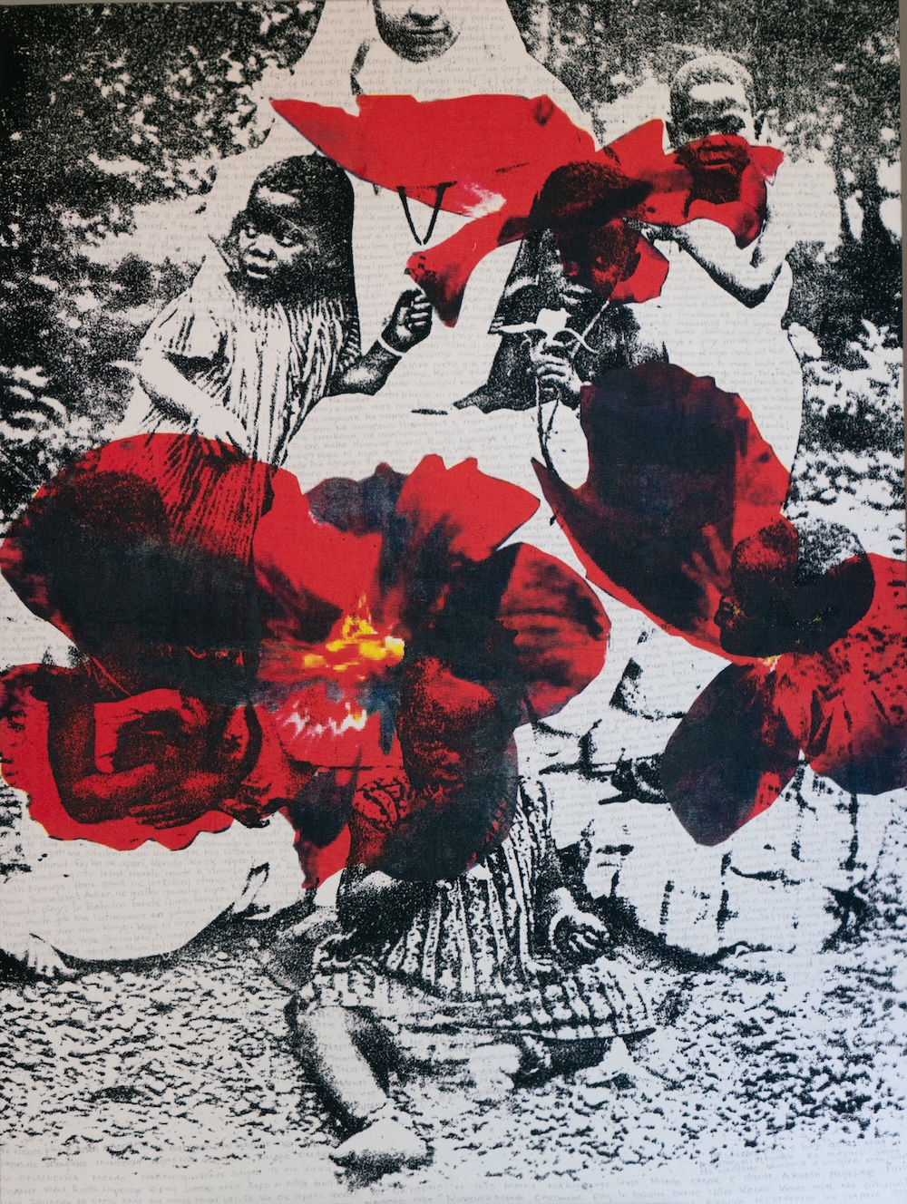 A close up on a print of a Black child printed in black and white. In pencil there is faint writing on the print.